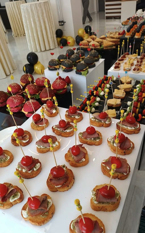 Canapé buffet with mini burgers and skewers